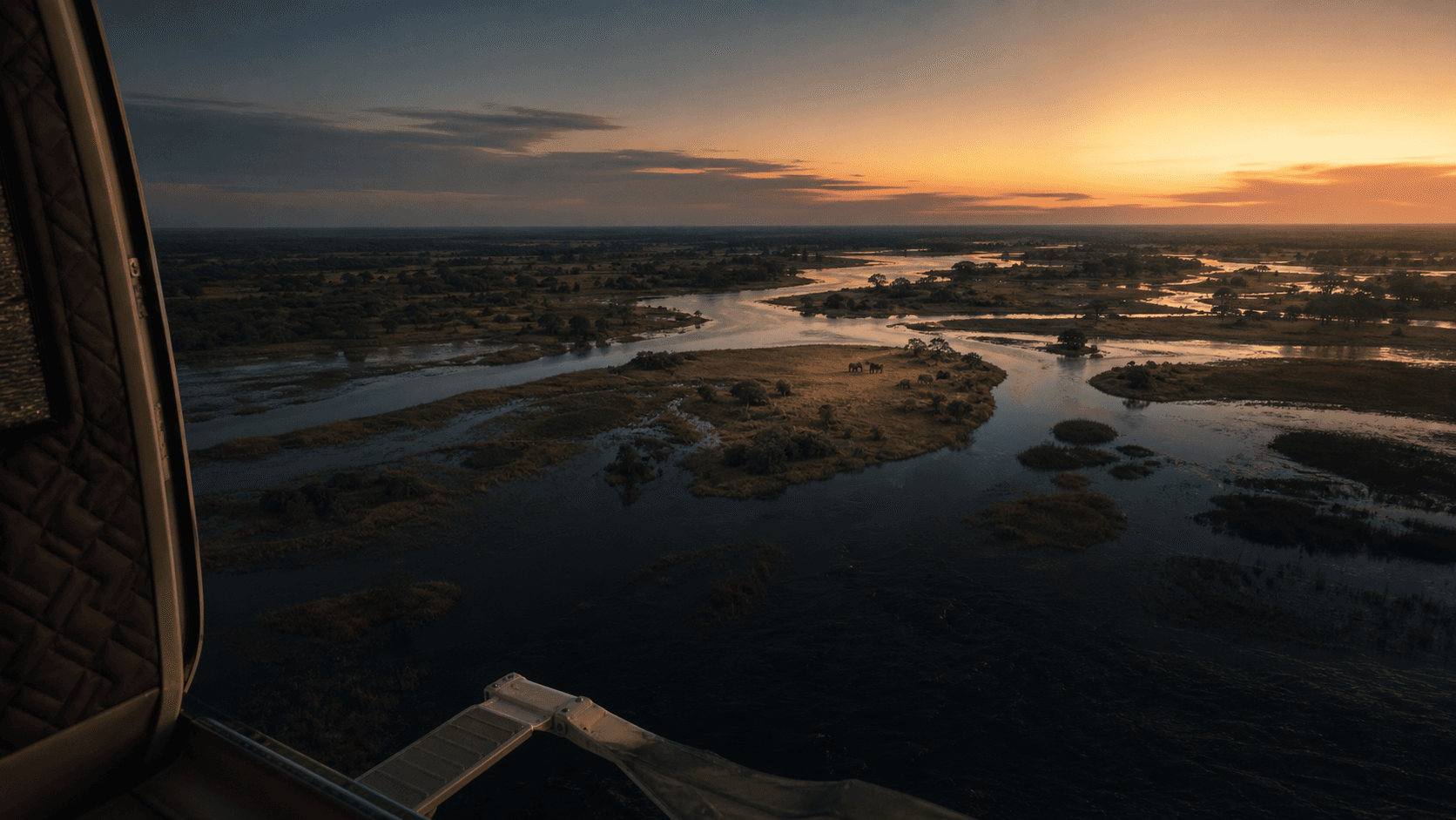 The Okavango Delta at sunset from a private aircraft